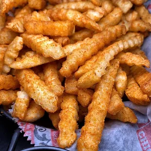 a basket of fries and dip