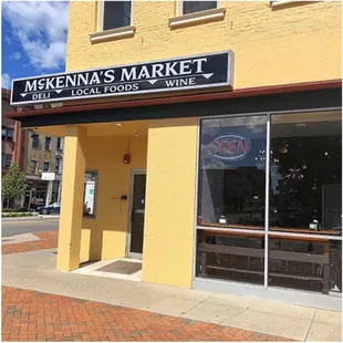 Store front with the only seating available (4 seats looking out the window)