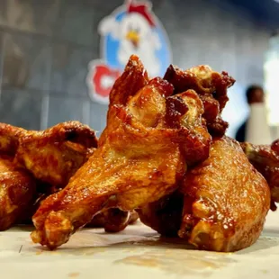 a pile of chicken wings on a counter