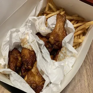 Soy glaze and honey orange wings with fries