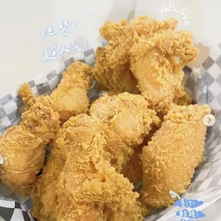 a basket full of fried chicken