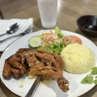 Crispy Fried Golden Chicken on Yellow Rice