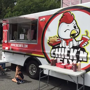 a chicken truck parked in a parking lot