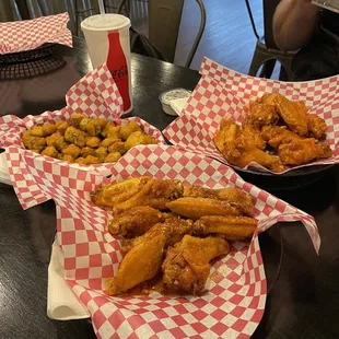 Lemon pepper and Hot wings with a large basket of okra.