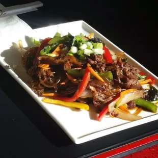 Bulgogi japchase thinly sliced Ribeye stir fried with Glass noodle and fresh veggies
