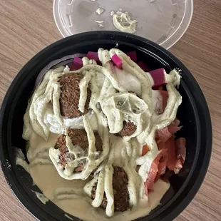 Falafel bowl doused in too much sauce.