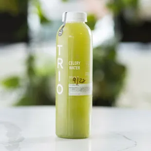 a bottle of juice sitting on a table