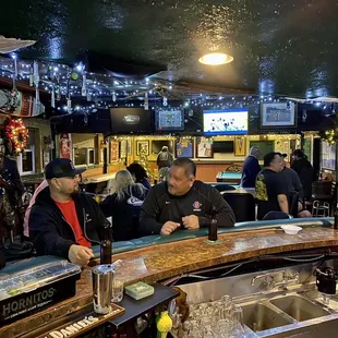 a group of people sitting at a bar