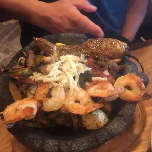 Molacajete. Steak, chicken, shrimp, peppers, onions, and zucchini. Steak was very dry and difficult to eat. Great chicken.