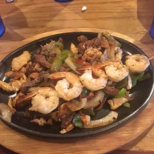 Fajitas Texavas! Great flavor, chicken was perfection, but the shrimp and steak were murdered. Dry and overcooked.