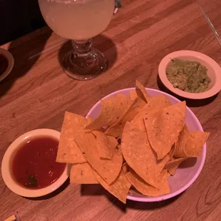 Chips, salsa, guacamole (extra charge for guacamole) and a margarita on the rocks.