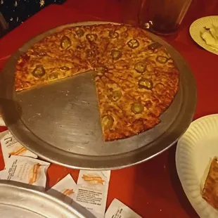 a pizza with a slice taken out of it