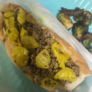 a hot dog and brussels sprouts