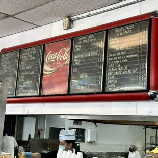 a menu board and a chef