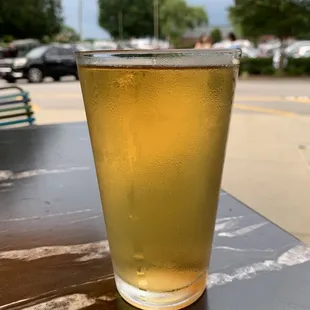 a glass of beer on a table