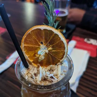 a drink with an orange slice