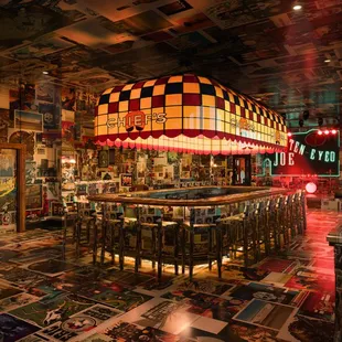 a bar with a checkered ceiling