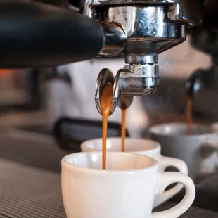 coffee being poured into a cup