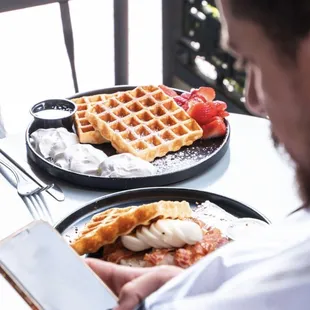 a man reading a menu