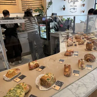 Savory bakery items, food and coffee counter area