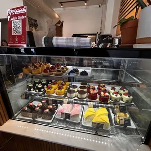a display of cakes and pastries