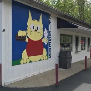 a dog holding a piece of cake