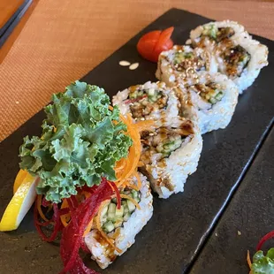 a plate of sushi on a table