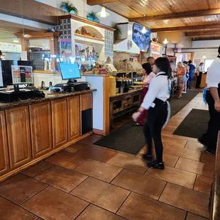 a woman walking through the counter