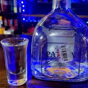 a bottle of tequila and a shot glass