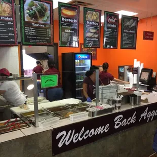 customers ordering food at the counter