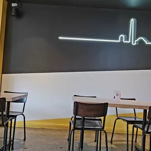 an empty restaurant with tables and chairs