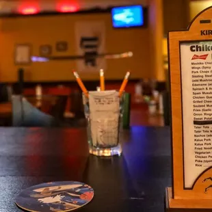 a menu and a drink