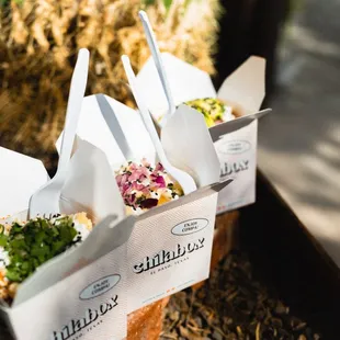 three take out boxes of food