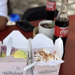 three boxes of food on a table