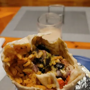 Lengua burrito w/ horchata in the background.