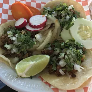 Two pastor tacos and one asada.