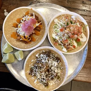 Tacos - Top left and clockwise: cochinita pibil, chicken tinga, flank steak