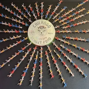 a clock made out of tiny figurines