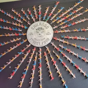 a group of tiny figurines arranged in a sunburst