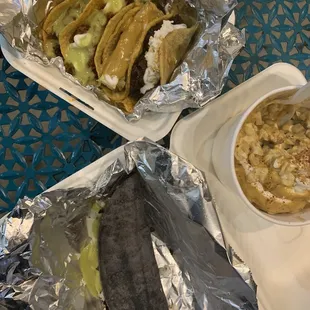 Large esquite, quesadilla and taco plate.