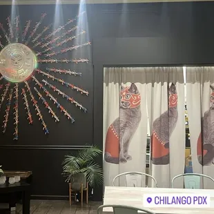 a dining room with a table and chairs