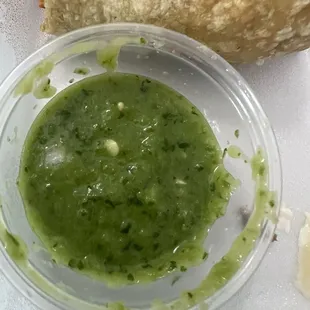 Guacamole sauce- delicious melding of avocado, jalapeno, cilantro and spices. This is on the condiment bar!