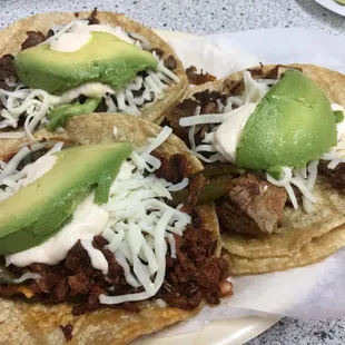Steak, carnitas and chorizo taco. Next time I'll skip the crema (sour cream) and cheese because the meat is outstanding on it's own.