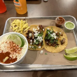 Al pastor tacos, elotes