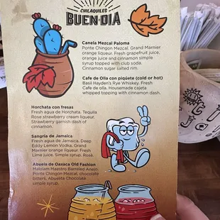 a hand holding a menu