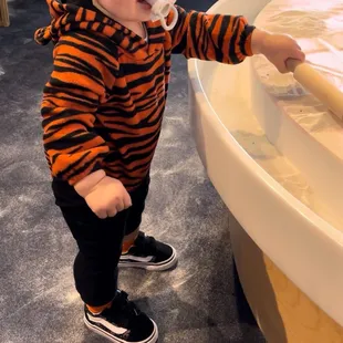 Playing with the sand in the 2nd floor "nursery"