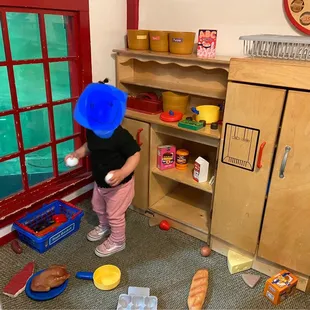 My toddler in the playhouse