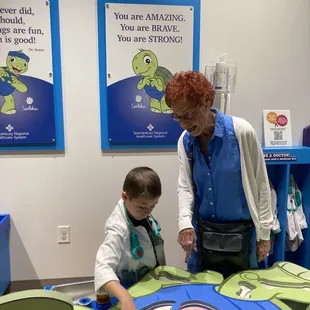 Irene helping the little with the parts and pieces.