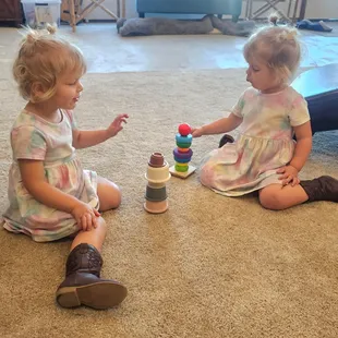 The twins got lots of new clothes AND toys!