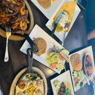 Enchiladas, Shrimp, Fajitas, beef Tamale, Side of corn tortillas, tacos.